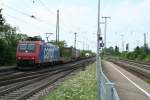 482 002-3 mit einem KLV-Zug am Morgen des 25.07.13 bei der Durchfahrt des Bahnhofs Müllheim (Baden) gen Norden.