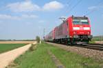 146 115 mit einem RE von Offenburg nach Basel Bad. Bf am Nachmittag des 13.04.14 sdlich von Hgelheim.