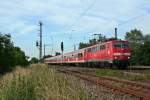 111 064 mit einem RE von Offenburg nach Schliengen am Abend des 06.06.14 in Orschweier.