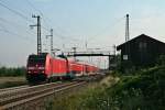 146 238-1 mit einem RE von Offenburg nach Basel Bad. Bf am Morgen des 01.08.14 beim Verlassen des Haltepunktes Auggen.