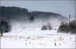 Vom Schnee eingehüllt -     Ein Güterzug im Lonetal zwischen Lonsee und Urpring.