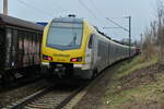 Nachschuß auf den ET 6.12 von GoAhead der hier gerade die 294 825-5 mit ihrem Güterzug in Kochendorf überholt bevor er in Bad Friedrichshall Hbf hält. Dienstag den 1.2.2022