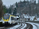 8442 319 kommt als MEX 18 nach Osterburken mit etwas Verspätung in Adelsheim Ost eingefahren am 22.1.2023