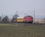 110 284-7 ist am 15. Mrz 2011 mit dem TbZ 48104 von Magdeburg-Rothensee nach Mnchen Hbf auf der Frankenwaldbahn bei Kronach unterwegs. Leider verschwand just in diesem Moment die Sonne hinter einer Wolke!