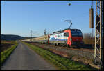SBB Cargo International 193 474 mit dem Centralbahn-Sonderzug DZ 56735 Köln - Augsburg am 27.02.2026 im Maintal bei Winterhausen. Der Zug beförderte die Fussball-Fans des 1. FC Köln zum Auswärtsspiel beim FC Augsburg.