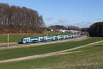 4010 028 die  Klima-Westbahn  aus Wien kommend am 18. Februar 2024 bei Axdorf im Chiemgau.
