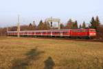 Die 111 026-1 mit der RB von Mittenwald nach München am Westkreuz am 11.12.2013