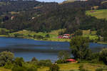 218 446-3 zieht ihren Dosto Radzug um den malerischen Alpsee am 19.7.20.