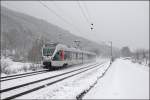ET23005 fhrt als ABR99606, (RE16  Ruhr-Sieg-Express ), bei Benolpe durch den frischen Schnee Richtung Siegen.
