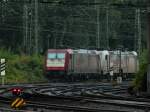 Zweimal Crossrail, 185 597-2 und 185 580-8  Jana  stehen am 23.07.2011 bei Nieselwetter in Aachen West.