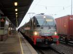 183 001-7 mit dem VX 81142 von Plauen(Vogtl) ob Bf nach Berlin Zoologischer Garten, bei einem lngeren Aufenthalt im Bahnhof Berlin Schnefeld Flughafen am 23. Dezember 2011 bei Nieselregen.