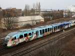 Der VT 06 der Vogtlandbahn mit Reklame fr das Vogtland am 14.03.2009 bei der Ausfahrt aus Regensburg Hbf in Richtung Hof.(Bahnbildertreffen)