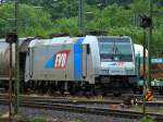 185 676-4 von Railpool im Dienst für die EVB am 11.07.2012 vor einem Getreidezug in Aachen West.