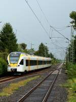 Kurz nach einem heftigen Regenschauer durchfährt ET 7.02 der Eurobahn am 16.08.2014 Kleinenbroich
