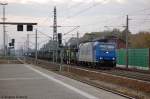 185 526-1 fr HGK - Hfen und Gterverkehr Kln AG mit leeren Autotransportzug in Rathenow Richtung Wustermark unterwegs. 26.10.2011