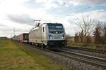 HGB Bombardier Traxx 187 501-2 mit Militärzug in Altheim bei Dieburg (Hessen) am 04.02.23