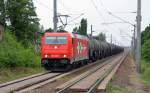 185 606 der HGK befrderte am 17.07.11 einen Kesselwagenzug durch Brehna Richtung Bitterfeld.