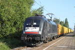 182 598-3 mit Holzzug von Rostock-Bramow nach Stendal-Niedergörne via Borstel Kr.Stendal bei der Durchfahrt am Morgen des 16.06.2017 im Haltepunkt Rostock-Holbeinplatz.