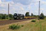 272 407-8 mit leeren Schwellentransportwagen in Fahrtrichtung Norden. Aufgenommen am 22.07.2014 bei Wahnebergen.