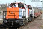 Die 214 006-9 der NBE zieht in DT einen Bauzug durch Wuppertal Vohwinkel am 02.04.2010
