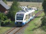 TW 703 der Ostseeland Verkehr GmbH fhrt in den Bahnhof von Rehna ein.