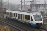 Seltener Gast auf der Strecke Rostock-Gstow:OLA79759 von Rostock Hbf nach Gstrow kurz nach der Ausfahrt im Rostocker Hbf.24.11.2011