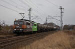 151 138 von HSL mit einem Kesselzug am 14.01.2023 in Stralsund am Abzweig Srg.