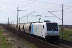 Railpool 185 677-2 im Dienst der ITL mit einem Transcereales Getreidezug in Magdeburg Diesdorf. Der Zug kam aus Richtung Braunschweig, fotografiert am 31.03.2010. 