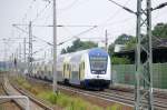 Hier der erste metronom Sonderzug nach Berlin 2010 bei durchfahrt in Rathenow. Bestehend aus 8 Waggons und der 146er  Rizzi-Lok  die den Sonderzug nach Berlin geschoben hat. 07.08.2010