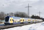 Dieser ungehinderte Blick entstand erst durch die Baumfllarbeiten fr den dreigleisigen Ausbau der Strecke Ashausen–Lneburg und ist inzwischen durch sechs Meter hohe Lrmschutzwnde verstellt: ME 80948 (Uelzen–Hamburg) am 06.03.2010 zwischen Lneburg und Bardowick