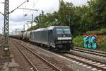 MRCE/Dispolok 185 563-4 mit Kesselwagen in Hamburg Harburg am 16.07.19 vom Bahnsteig aus fotografiert 