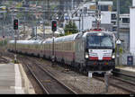MRCE - Extrazug mit Lok  91 80 6 193 711-9 und AEK Rheingold Personenwagen bei der durchfahrt im Bahnhof von Yverdon les Bains am 25.09.2019