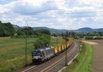 X4E-867 von MRCE zieht am 11.August 2016 einen S21-Aushubzug bei Gambach in Richtung Gemünden(Main).