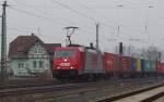 186 133-5 mit Containerzug in Richtung Norden. Aufgenommen am 19.02.2011 in Mecklar.