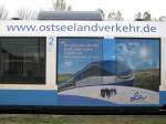 Werbung auf einem TW 703 der OLA NL Schwerin