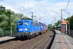 140 017-5 rauscht mit einem Containerzug durch Magdeburg Herrenkrug gen Magdeburg.