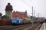 145 030-7 PRESS (145 085-7) mit Holzzug in Rathenow in Richtung Stendal unterwegs. 16.03.2011