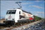 PRESS 145 023-6 wartet am 24.01.2013 mit einem Holzzug von Stralsund-Rgendamm nach Aschaffenburg im Bbf Langendorf auf Weiterfahrt.