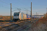 Am 27.11.22 rollte 187 304 der Railpool mit der Wagenlok 76 110 von raildox durch Brehna Richtung Halle(S).