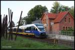 Künstlerbahnhof IKTOMIA, Domizil des Künstlers Volker Trieb. Es handelt sich in Wahrheit um den Haltepunkt Osnabrück - Sutthausen gelegen am  Haller Willem . 
Am 6.7.2015 um 06.09 Uhr hielt dort planmäßig VT 643327 der Nordwestbahn auf dem Weg nach Osnabrück.