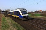 NWB 648 191-4, 691-3 (Bj. 2003, Alstom) VT LINT 41 der NordWestBahn als NWB 82974 Hildesheim Hbf. - Hameln, KBS 372 Weserbahn Hildesheim - Bünde (Westf.), fotografiert vor der Ortskulisse Burgstemmen mit der Poppenburg am 02.04.2016 