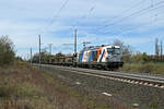 Mit einem leeren ARS-Autozug �berholte 248 012 der Locon eine vorrausfahrende S-Bahn Richtung Bitterfeld. Fotografiert am 09.04.26 in Brehna.