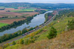 185 510 ATLU/TXL mit einem KLV-Zug bei Gambach Richtung Würzburg, 07.10.2021