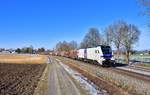 159 201 mit einem Holzzug am 31.01.2021 bei Langenisarhofen.