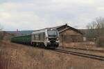 159 211 (90 80 2159 211 2D-RCM) der Starkenberger Baustoffwerke GmbH (SBW) am 24.2.2022 mit einem leeren Sandzug auf dem Weg von Saalfeld/Saale nach Kayna.