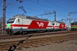 Sr 2 3204 und  Sr2 3231  stehen am 10.4.2014 in Angesicht der Sr 1 3039 im Bahnhof Kouvola bereit.