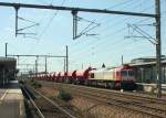 AKIEM 77502 kam am 16.6.2015 mit einem Schotterwagenzug aus Richtung Paris durch den Bahnhof Chelles.