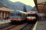 FS ALn 663 1159 und SNCF X 4534 im Bahnhof Breil sur Roya der Tendabahn (März 1987). Diese Bahn in den Seealpen durch das französisch-italienische Grenzgebiet verbindet Turin und Nizza, in Breil sur Roya zweigt eine Linie nach Ventimiglia ab. Kaum eine andere Bahnlinie hat eine ähnlich bewegte Geschichte: erst 1928 ereöffnet wurde sie Mitte der 1930er Jahre elektrifiziert und nach schweren Zerstörungen im 2. Weltkrieg stillgelegt. Der Verkehr auf der Bergstrecke wurde erst 1979 wieder aufgenommen.