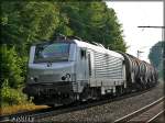 AKIEM 37031 durcheilt mit einem Kesselzug den Bahnhof Michelau am 27.7.2012