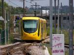 12.07.11 , Mulhouse , aus der Station Musees ist eine Tram Richtung Gare Centrale ausgefahren.